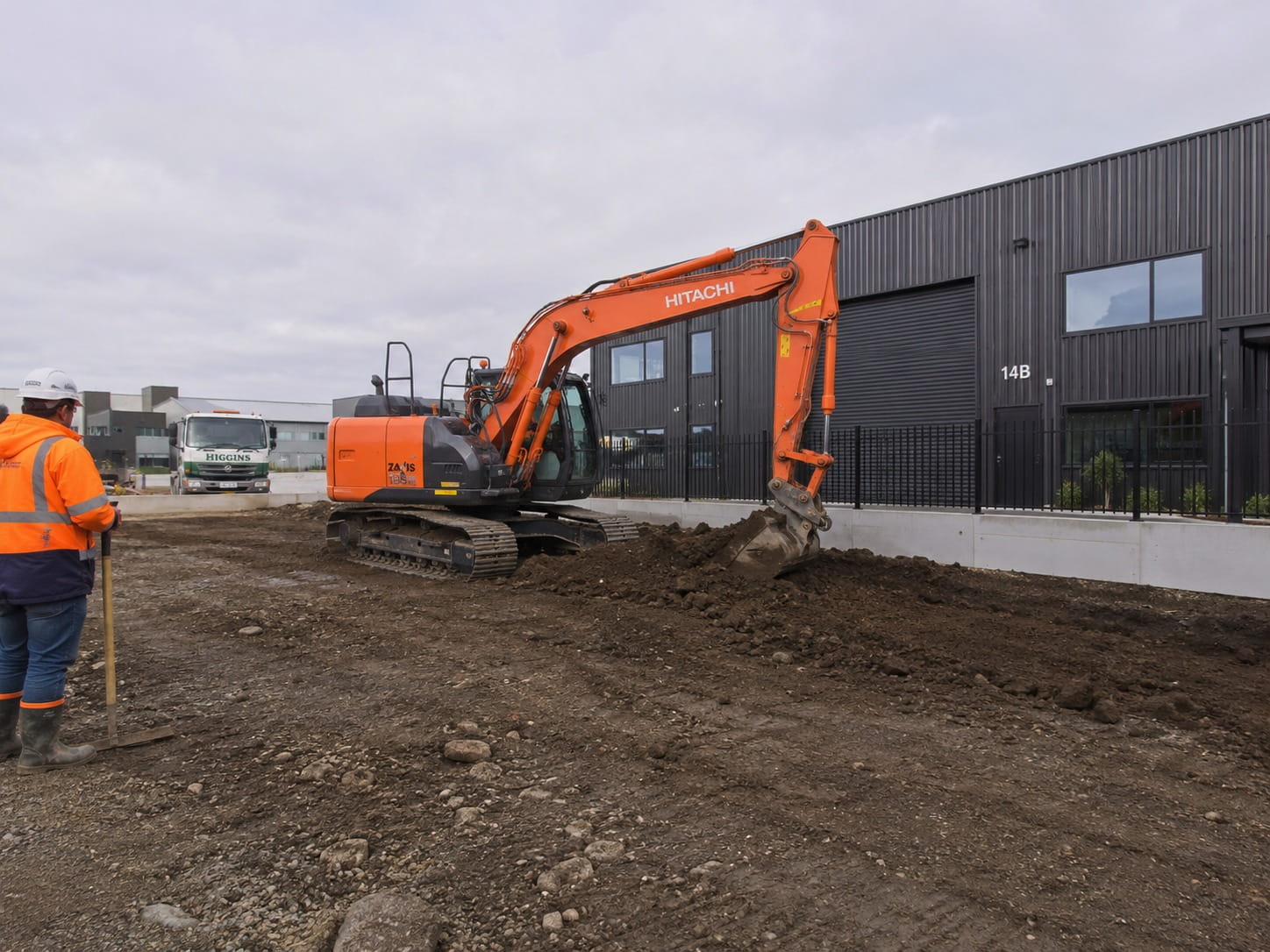 Excavator and truck carrying out drainage groundwork in Hamilton